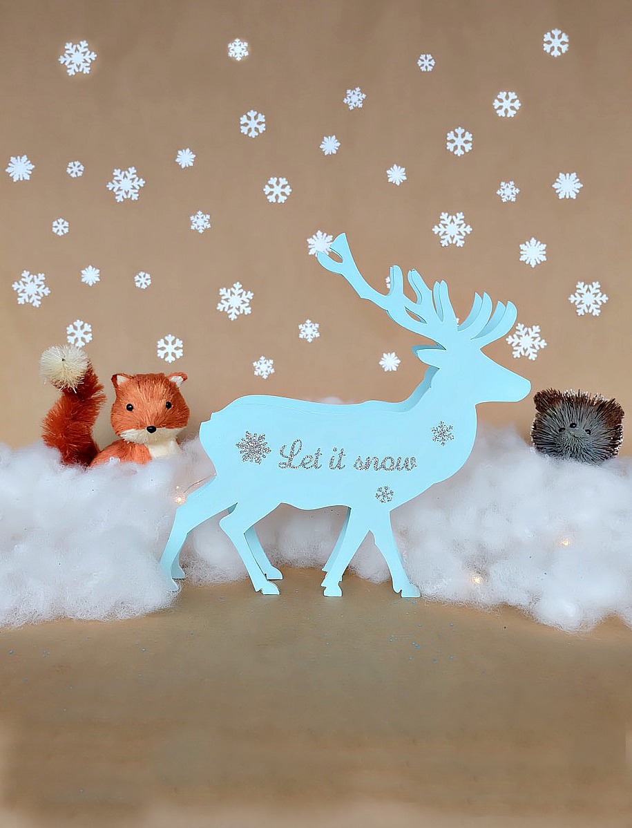 This beautiful DIY reindeer Christmas Ornament is cut using the Cricut Maker! Decorated with "Let It Snow" it makes a beautiful handmade gift idea! This step by step tutorial with photos teaches you how to cut chipboard using your Cricut Maker to make beautiful home decor items. Make handmade reindeer decorations as teacher gifts, gifts for mom, or gifts for a friend. #HandmadeGift #CricutMaker #Christmas #Reindeer