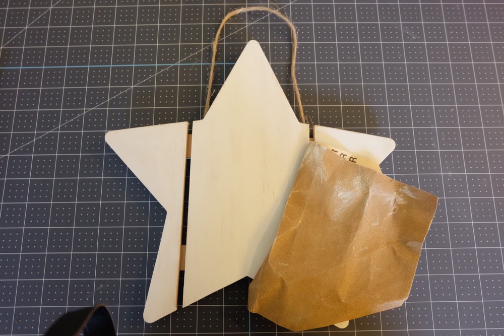 Find out how easy it is to turn an unfinished wood sign into a DIY Wood Christmas Sign with this awesome step by step tutorial. Includes a free Merry and Bright Christmas SVG file that you can cut using your Cricut or Silhouette to to make this beautiful quick handmade gift idea! Perfect for a DIY front door Christmas sign or to hang on a door handle or on the wall inside the house. Let the Christmas decorating begin! #Cricut #Silhouette #Christmas #WoodSign