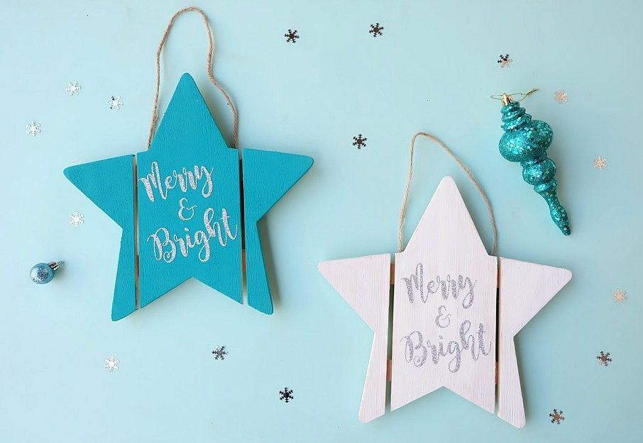 Find out how easy it is to turn an unfinished wood sign into a DIY Wood Christmas Sign with this awesome step by step tutorial. Includes a free Merry and Bright Christmas SVG file that you can cut using your Cricut or Silhouette to to make this beautiful quick handmade gift idea! Perfect for a DIY front door Christmas sign or to hang on a door handle or on the wall inside the house. Let the Christmas decorating begin! #Cricut #Silhouette #Christmas #WoodSign