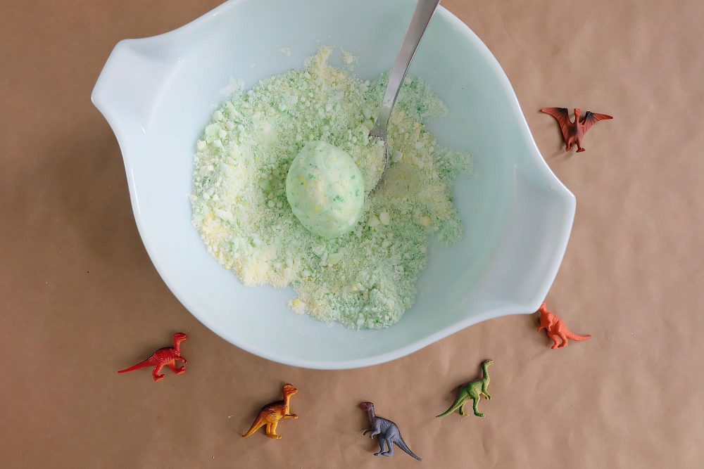 Bath bombs are easy to make at home, if you know how! Learn how to make these DIY Dinosaur Egg Bath Bombs. They have little toy dinosaurs hidden inside and make a great gift idea for dinosaur loving boys and girls! Give them as a handmade stocking stuffer and make bath time fun! #StockingStuffer #Handmade #DIY #Dinosaur #BathProduct
