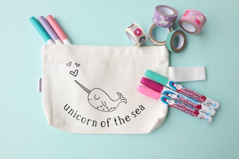 Create a sweet little DIY Narwhal Zippered Pouch that the recipient can color in! This thoughtful handmade gift takes only minutes to make and is a thoughtful handmade gift idea for kids (or adults!) It's a coloring sheet and a pencil pouch in one! #Cricut #Narwhal #DIY #Coloring