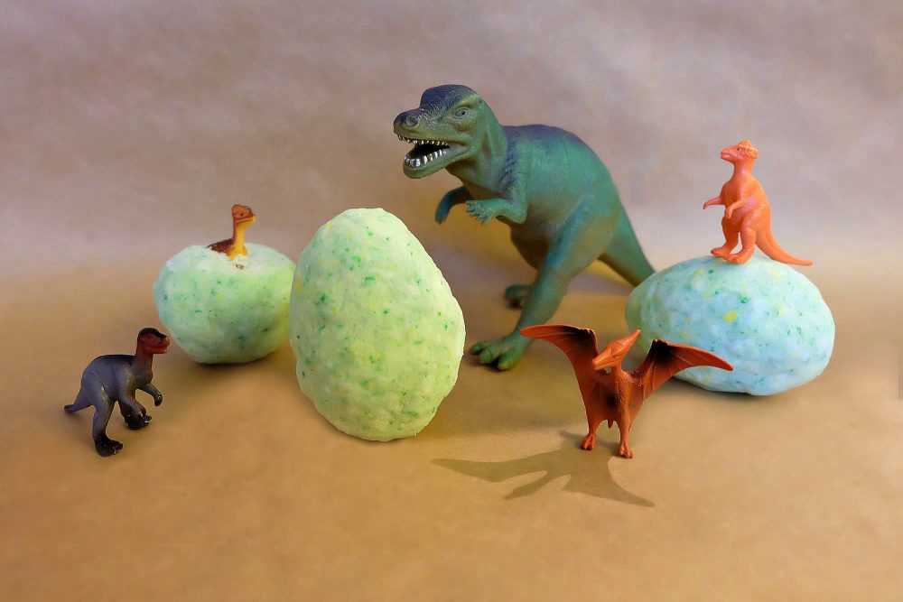 Bath bombs are easy to make at home, if you know how! Learn how to make these DIY Dinosaur Egg Bath Bombs. They have little toy dinosaurs hidden inside and make a great gift idea for dinosaur loving boys and girls! Give them as a handmade stocking stuffer and make bath time fun! #StockingStuffer #Handmade #DIY #Dinosaur #BathProduct