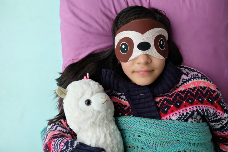 This might be the most fun Cricut Maker project ever! How adorable is this DIY Sloth Sleep Mask? This easy project only takes 15 minutes to make. Includes a step by step tutorial and cut file for cutting with your Cricut Maker or Cricut Explore! Would make adorable party favors for a sloth birthday slumber party! #Cricut #Sloth #Sewing #Craft