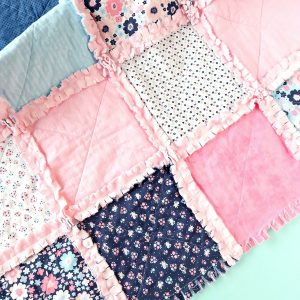Learn how to make a DIY Rag Quilt using your Cricut Maker! Includes step by step photos, instructions, and a cut file for your Cricut! A great tutorial even if you dont have a Cricut! Learn the easiest way to make a rag quilt. Perfect for handmade gifts including baby shower gifts, birthday gifts and Christmas gifts for your friends and family! #RagQuilt #Cricut #CricutMade #CricutMaker #Sewing #Sponsored