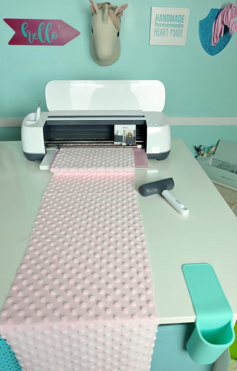 Learn how to make a DIY Rag Quilt using your Cricut Maker! Includes step by step photos, instructions, and a cut file for your Cricut! A great tutorial even if you dont have a Cricut! Learn the easiest way to make a rag quilt. Perfect for handmade gifts including baby shower gifts, birthday gifts and Christmas gifts for your friends and family! #RagQuilt #Cricut #CricutMade #CricutMaker #Sewing #Sponsored