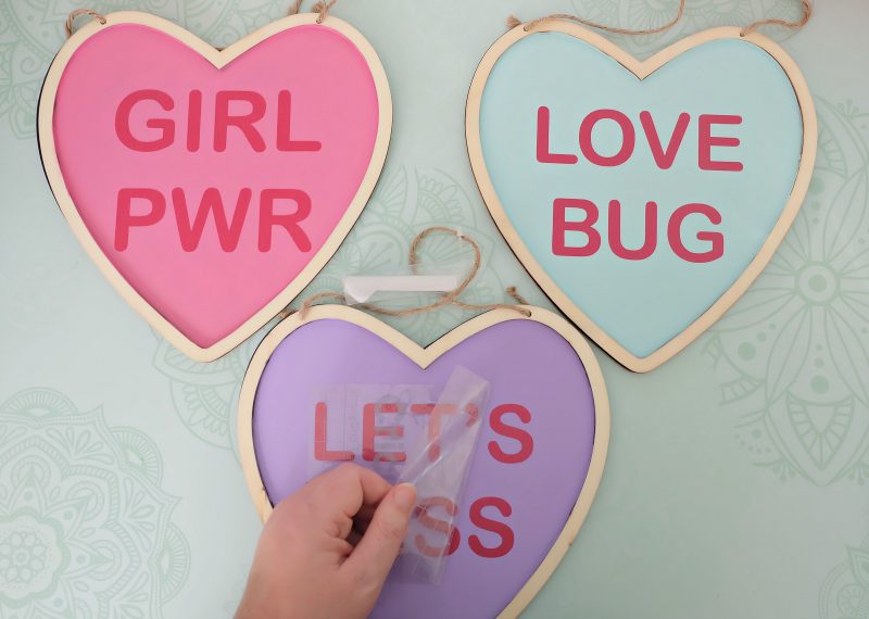 Make an adorable DIY Conversation Heart Sign using a wood sign from the dollar store, your Cricut or Silhouette and one of our 15 free Conversation Heart SVG Files! This easy craft is perfect for decorating for Valentines Day! #ValentinesDay #DIY #Cricut #DollarStoreCrafts
