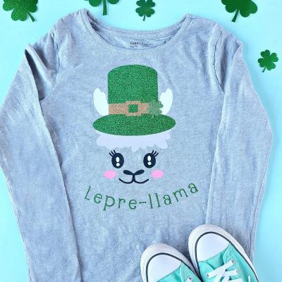 Love llamas? We're making you pinch proof with the CUTEST DIY St Patricks Day Shirt ever! Its a Lepre-llama and you can make it with your Cricut! Leprechauns have never looked cuter than with this llama twist! Includes step by step instructions including tips for layering htv. #Cricut #CricutMade #DIY #Llama #StPatricksDay #Sponsored