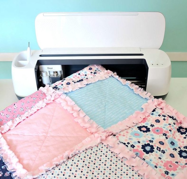 Learn how to make a DIY Rag Quilt using your Cricut Maker! Includes step by step photos, instructions, and a cut file for your Cricut! A great tutorial even if you dont have a Cricut! Learn the easiest way to make a rag quilt. Perfect for handmade gifts including baby shower gifts, birthday gifts and Christmas gifts for your friends and family! #RagQuilt #Cricut #CricutMade #CricutMaker #Sewing #Sponsored