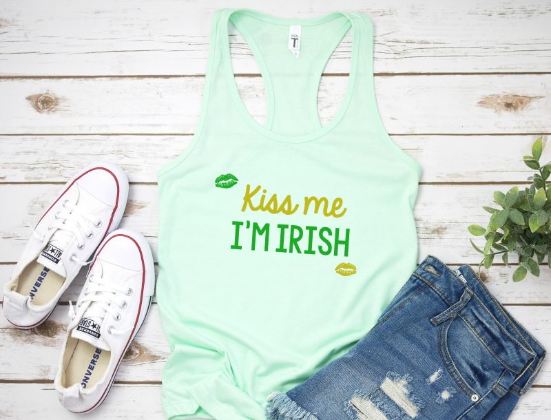 DIY your St. Patrick's Day shirt this year! Pull out your Cricut or Silhouette and get crafting with this easy idea! Use our free St Patricks Day SVG File to cut your own Kiss Me I'm Irish shirt or tank top! #StPatricksDay #StPatricksDayShirt #KissMeImIrish #Cricut #Silhouette