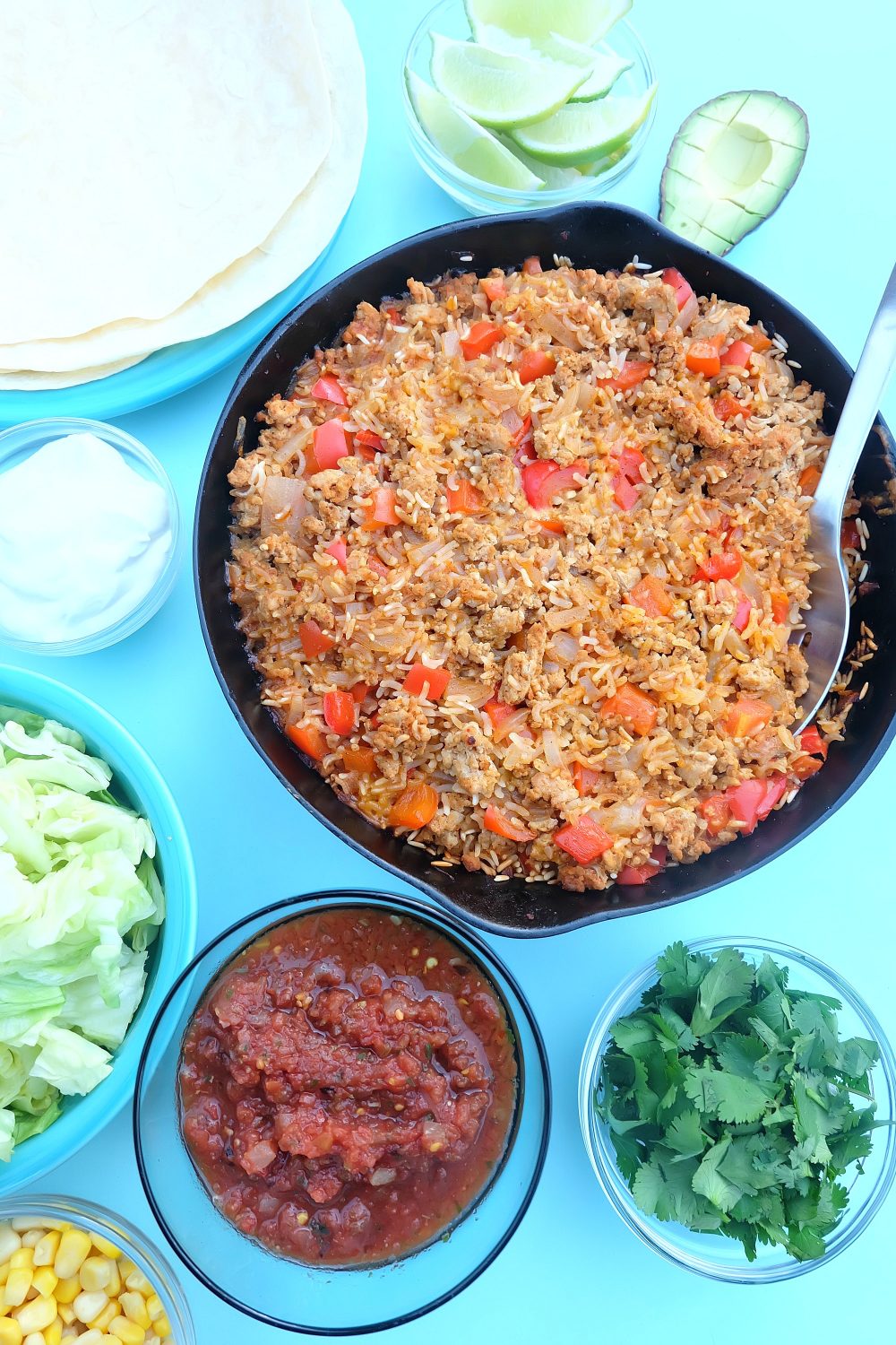 Looking for a quick and easy, one pan healthy dinner idea that will feed a crowd? This ground turkey and rice Mexican casserole recipe only takes 10 minutes to prep, then you pop it in the oven. Perfect for filling tacos, burritos or using as a topping for taco salad! A healthy, delicious and family friendly meal idea! #MakeItWithTurkey #Recipe #Mexican #Turkey #OnePan