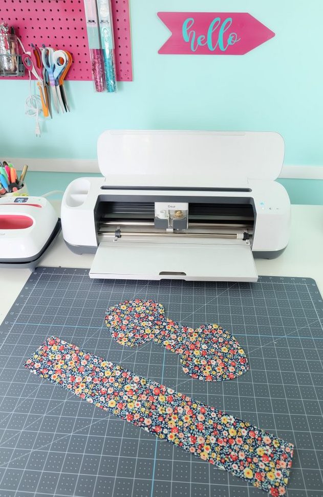 Some people call them a bunny ear scrunchy others a knot or bow scrunchy, whatever they are called, they sure are cute!. Sew one with our easy 10 minute sewing tutorial using our step by step instructions with photos and our free Cricut Maker SVG cut file! This quick and easy sewing project makes a great handmade gift! Perfect for Easter basket stuffers, stocking stuffers, presents for girls and party favors! #Sewing #EasySewing #CricutMaker #CricutMade