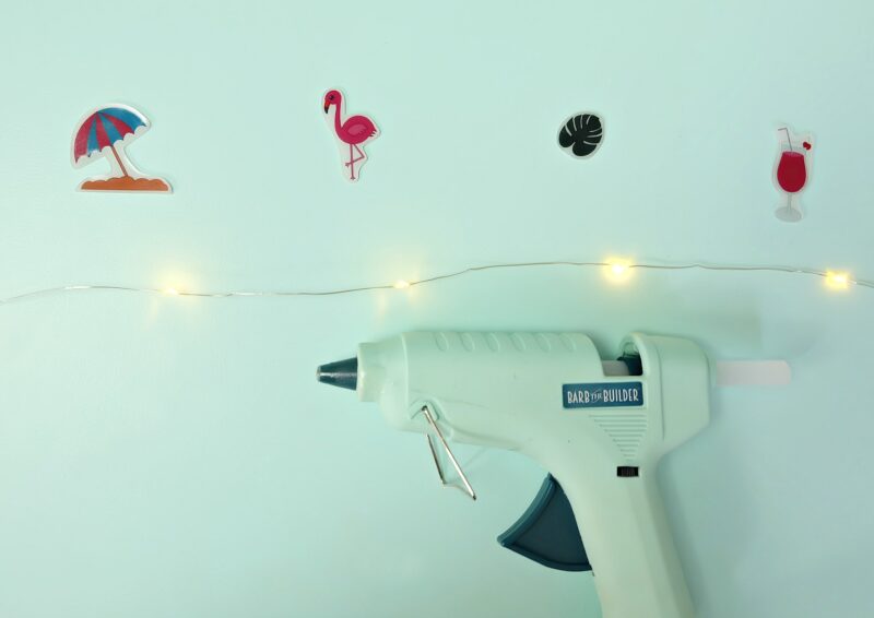 Create an adorable set of DIY Summer Flamingo Fairy Lights using shrink plastic (aka Shrinky Dinks) and our free summer flamingo printable. Perfect for summer decor or tropical themed luau birthday parties! Fun and oh so easy to make! #ShrinkyDinks #Flamingo #SummerCrafts #DIY