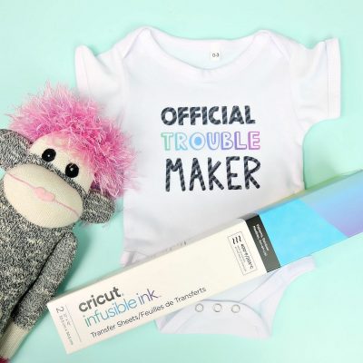 Learn how to use Cricut Infusible Ink to make this adorable DIY baby onesie! It's an easy craft idea that makes a super cute handmade baby gift! Includes step by step instructions for using Infusible Ink! #Ciricut #BabyShower #Handmade #InfusibleInk #CricutMade