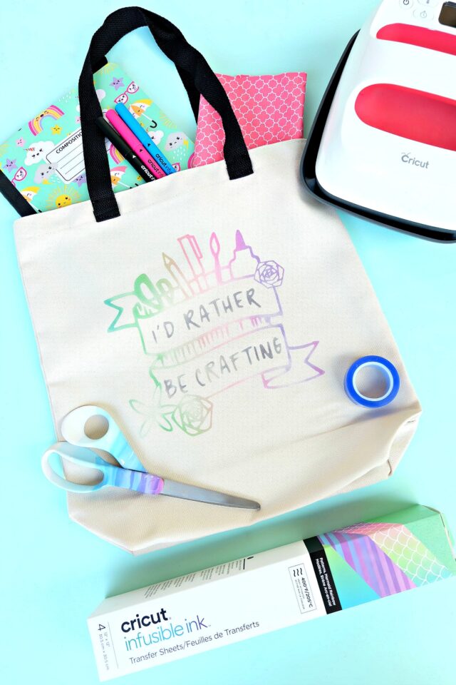 Make a gorgeous rainbow "watercolor" craft tote bag using Cricut Infusible Ink! We're sharing all the tips and tricks that you need to know to use Cricut Infusible Ink! Follow along as we share step by step instructions for this fun and easy craft project! #CricutMade #crafting #infusibleink #sponsored