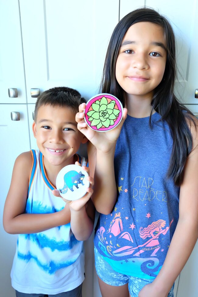 Make the cutest coasters that your kids can color in permanently using Cricut Infusible Ink! We're sharing all the tips and tricks that you need to know to use Cricut Infusible Ink! Follow along as we share step by step instructions and photos for this fun and easy project! #CricutMade #kidscrafts #infusibleink #sponsored