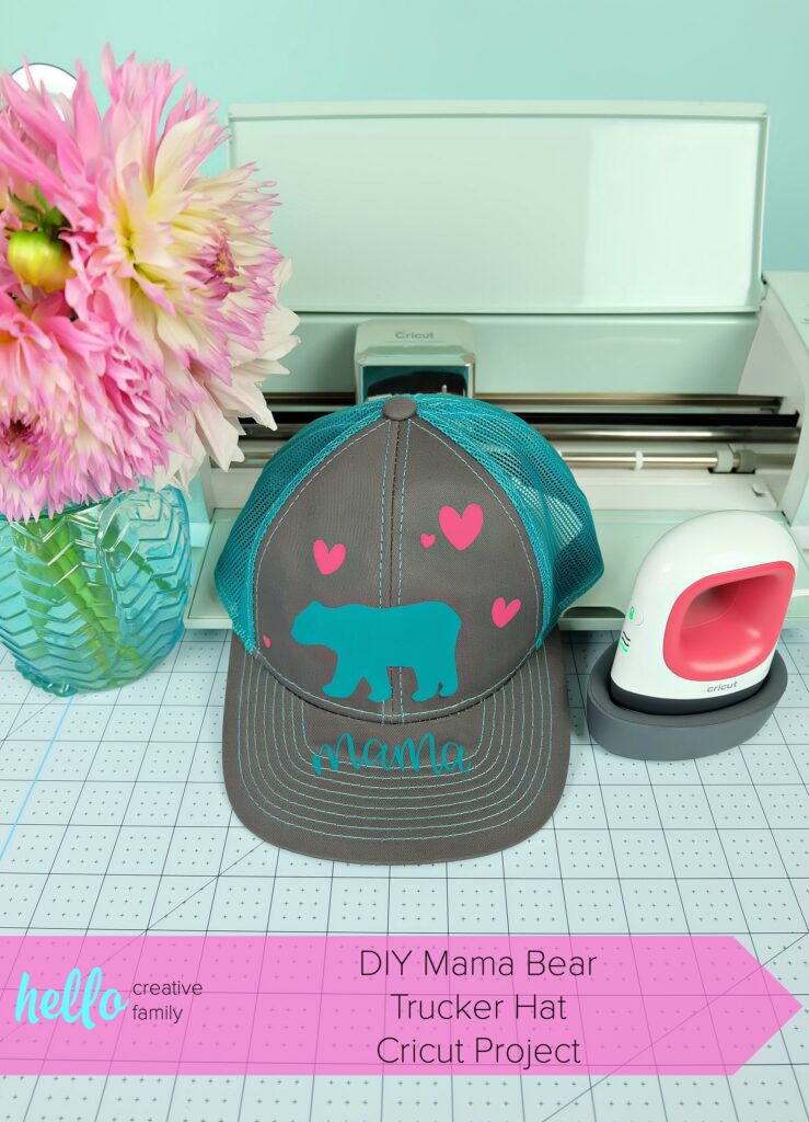 Make a DIY Mama Bear Trucker Hat using your Cricut with our easy step by step instructions! The perfect handmade gift for moms, new mamas and mommies to be! So fun to wear camping and in the great outdoors! An easy project for the Cricut Maker or Cricut Explore! #CricutCreated #CricutMade #DIYCamping #MomGift #Sponsored 