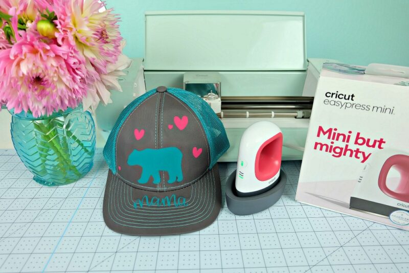 Make a DIY Mama Bear Trucker Hat using your Cricut with our easy step by step instructions! The perfect handmade gift for moms, new mamas and mommies to be! So fun to wear camping and in the great outdoors! An easy project for the Cricut Maker or Cricut Explore! #CricutCreated #CricutMade #DIYCamping #MomGift #Sponsored 