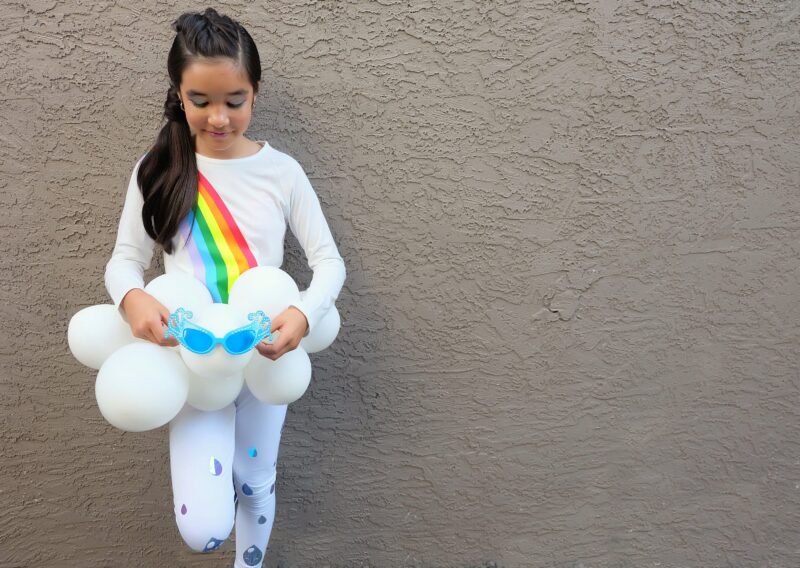 Create an Easy DIY Rainbow Halloween Costume out of leggings and a white shirt using your Cricut Maker or Cricut Explore Air 2! We're sharing step by step photos and the cut file to create this costume at home! #Cricut #HalloweenCostume #Rainbow #CricutCreated #Sponsored 