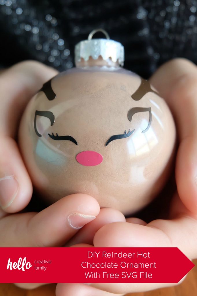 Learn how to make a DIY Reindeer Hot Chocolate Ornament using your Cricut Maker or Cricut Explore! These easy ornaments make a great handmade teacher's gift and gifts for kids. Includes a free Reindeer Face SVG File. #FreeSVG #CricutChristmas #CricutCrafternoon #HandmadeGifts #CricutCreated