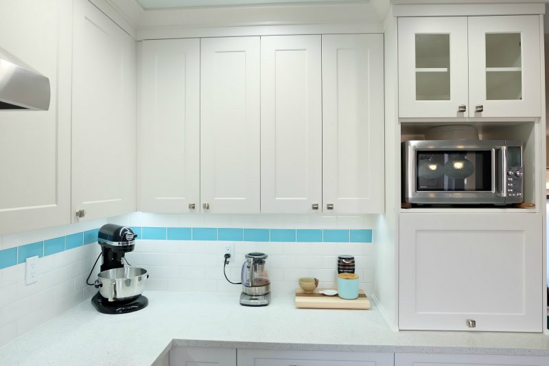 Get those appliances off the countertop and tucked away hidden with an appliance garage! Hello Creative Family selected a palette of white, grey, teal, turquoise and aqua for their kitchen renovation! This DIY teal kitchen remodel includes a colorful island and other smart features. Also check out her 20 Tips for a Smooth Kitchen Renovation! #Sponsored #Turquoise #Kitchen #Aqua #KitchenRemodel #kitchenrenovation