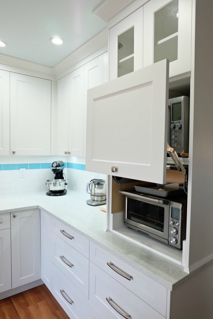 Get those appliances off the countertop and tucked away hidden with an appliance garage! Hello Creative Family selected a palette of white, grey, teal, turquoise and aqua for their kitchen renovation! This DIY teal kitchen remodel includes a colorful island and other smart features. Also check out her 20 Tips for a Smooth Kitchen Renovation! #Sponsored #Turquoise #Kitchen #Aqua #KitchenRemodel #kitchenrenovation