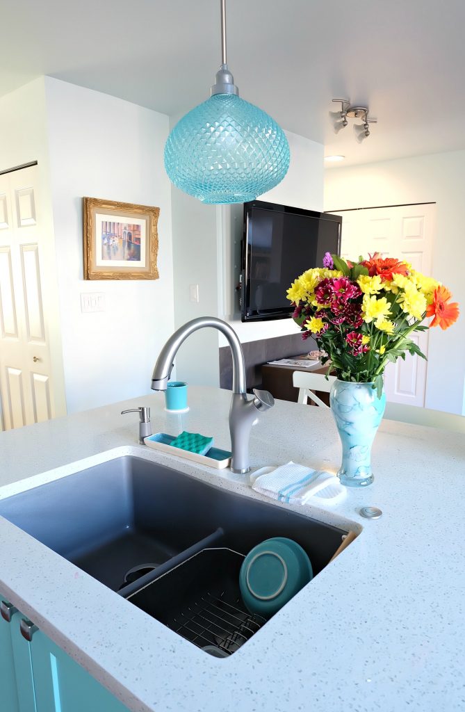 Pulling together a great kitchen renovation is all in the details! Hello Creative Family shares how she combined turquoise, aqua, white and grey elements to pull together a beautiful kitchen remodel including a teal kitchen island and a metallic grey Blanco Silgranit sink! #Sponsored #KitchenRenovation #KitchenRemodel #Turquoise #Teal #Aqua #kitchen