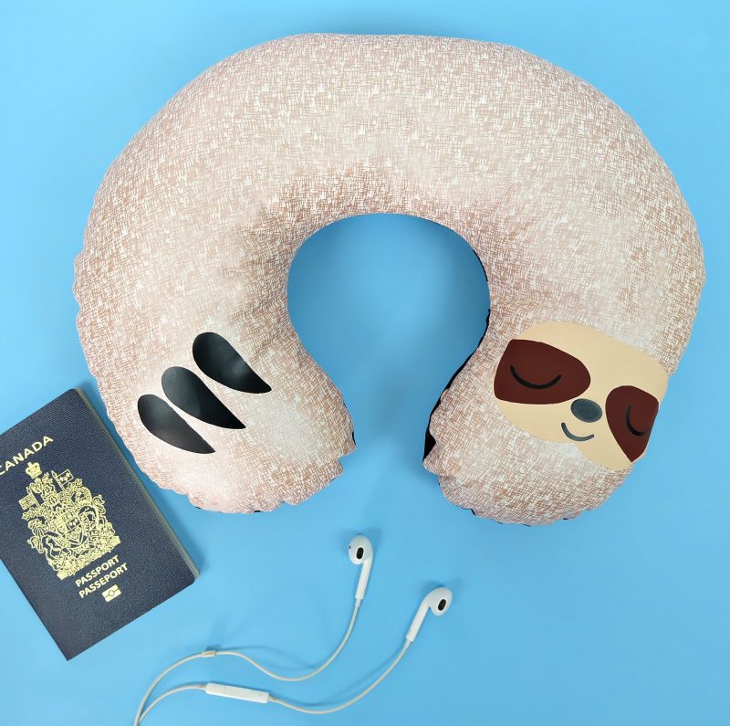 Would you believe that this adorable DIY Sloth Travel Pillow takes just 20 minutes to make using your Cricut Maker? It makes the cutest quick and easy handmade gift! Whip up a batch of them for a family who loves to travel. Includes a free sloth SVG cut file and step by step Cricut sewing instructions. #Sloth #CricutMade #CricutCreated #Travel #TravelAccessories #Sewing