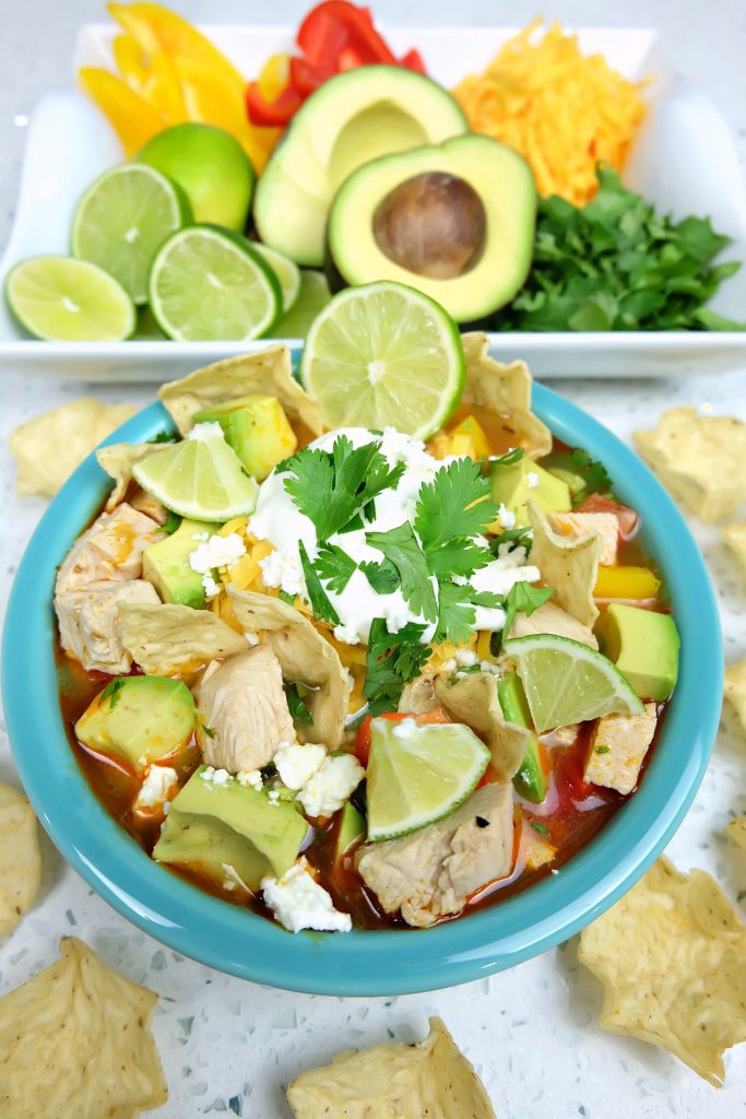 Take those Christmas or Thanksgiving Turkey Leftovers and turn them into an incredibly delicious and healthy meal your family will love with this Turkey Tortilla Soup Recipe! Perfect to warm you up on a cool day! #Sponsored #Turkey #Soup #Recipe #TurkeyTraditions