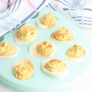 Use up those leftover Easter hardboiled eggs with this easy and yummy greek yogurt devilled eggs recipe! If made with non-fat yogurt they make a zero point weight watchers snack! A delicious and easy appetizer to make when entertaining. Perfect for Easter brunch. A healthy, family friendly snack packed with protein! #Easter #Recipe #DevilledEggs #Eggs #Snack #Appetizer #WeightWatchers