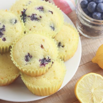 With the sweet burst of blueberries and tartness of lemons this gluten free lemon blueberry muffin recipe is easy and delicious! Takes just 5 minutes of prep and 25 minutes to bake which means hot muffins on the table in just 30 minutes! Who doesn't love an easy 30 minute muffin recipe? Includes substitutions for making with all purpose flour too. The perfect snack to satisfy a sweet tooth! #Baking #Recipe #Blueberry #lemon #BlueberryRecipes #Muffins