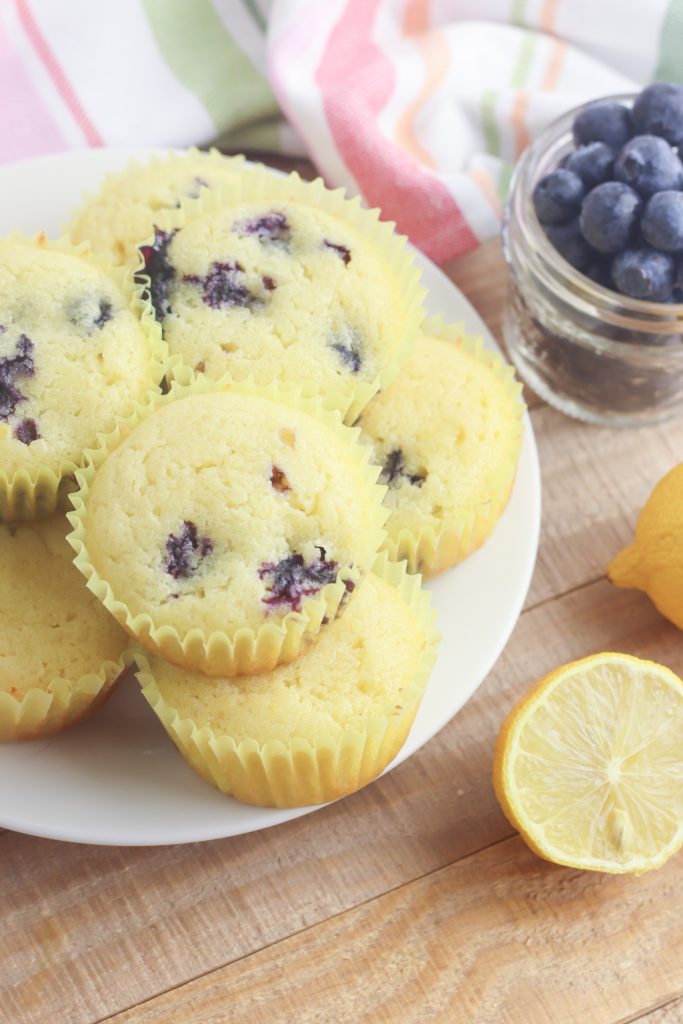 With the sweet burst of blueberries and tartness of lemons this gluten free lemon blueberry muffin recipe is easy and delicious! Takes just 5 minutes of prep and 25 minutes to bake which means hot muffins on the table in just 30 minutes! The perfect Mother's Day Breakfast Recipe! Who doesn't love an easy 30 minute muffin recipe? Includes substitutions for making with all purpose flour too. The perfect snack to satisfy a sweet tooth! #Baking #Recipe #Blueberry #lemon #BlueberryRecipes #Muffins #MothersDay #Breakfast