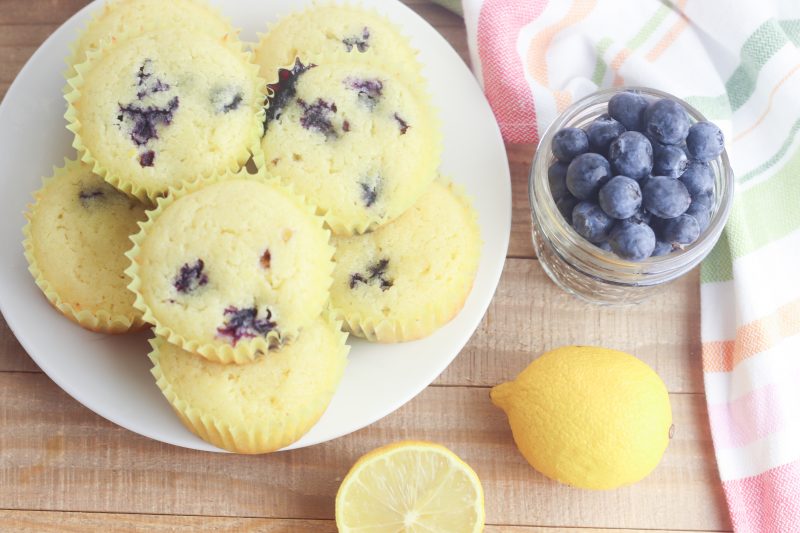 With the sweet burst of blueberries and tartness of lemons this gluten free lemon blueberry muffin recipe is easy and delicious! Takes just 5 minutes of prep and 25 minutes to bake which means hot muffins on the table in just 30 minutes! The perfect Mother's Day Breakfast Recipe! Who doesn't love an easy 30 minute muffin recipe? Includes substitutions for making with all purpose flour too. The perfect snack to satisfy a sweet tooth! #Baking #Recipe #Blueberry #lemon #BlueberryRecipes #Muffins #MothersDay #Breakfast