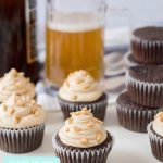 The perfect dessert to steal a man's heart-- our Chocolate Beer Cupcakes Recipe! With chocolate and beer in the batter, a peanut butter buttercream frosting and salty peanuts sprinkled on top, this recipe is the ultimate dad dessert! Perfect for Father's Day, birthdays and just because! #Cupcakes #Beer #Recipe #BeerRecipe #ChocolateCupcakes #FathersDay #Dessert #FathersDayCupcakes #FathersDayDessert #BeerRecipes