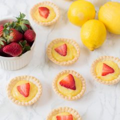 The perfect summer dessert recipe! Looking for a strawberry recipe to make with your summer berries? This one with have your mouth watering-- It's a Strawberry Lemon Tarts Recipe that is family friendly and delicious! Perfect for tea parties and summer desserts! #Strawberries #Baking #StrawberryRecipe #Recipes #Tarts #Pie #Homemade #StrawberryTart #StrawberryPie