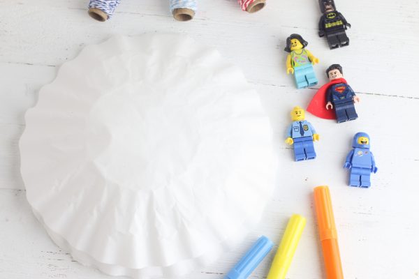 Looking for a DIY Lego Craft Idea? These DIY Lego Superhero Parachutes are fun and easy to make with supplies you probably already have at home! Make for Lego Star Wars characters, Lego Minecraft Characters, Superhero Lego Characters and more! Great lego crafts for birthday parties! #Lego #Crafts #LegoBirthday #LegoCrafts #LegoIdeas #CraftProjects #KidsCrafts