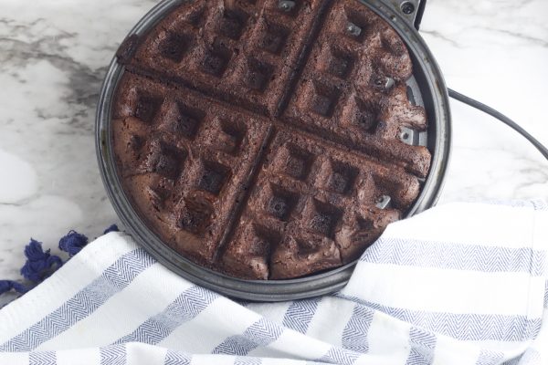 Ummmm YUM!!! Waffle Brownie Ice Cream Sandwiches?!?!? Yes please! Pull out that waffle maker, a box of brownie mix and a tub of ice cream and get ready to create your new favorite dessert idea! This recipe is so easy to make, and is the perfect hot summer day treat (or during the fall, winter or spring when you want a bit of comfort food). Make this homemade ice cream sandwich recipe once and you'll be batch cooking this dessert for your freezer! #IceCream #IceCreamSandwich #Summer #SummerRecipe #Recipe #DessertRecipe #IceCreamRecipe #homemade #waffle #Brownie #Wafflebrownie
