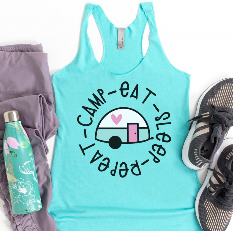 Blue tank top with the words Camp Eat Sleep Repeat and a cute pink and blue vintage trailer