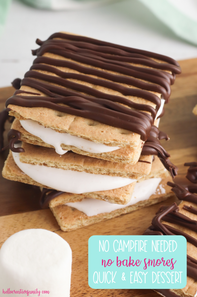 All the flavor of campfire smores without going camping! This No Bake Smores Recipe is a quick and easy, delicious dessert idea that can be made at home in minutes! Chocolate, graham cracker, marshmallow fluff! Who could ask for more? #smores #Dessert #EasyDessert #DessertIdea #CampingBirthday #homemade #Recipe #Marshmallow