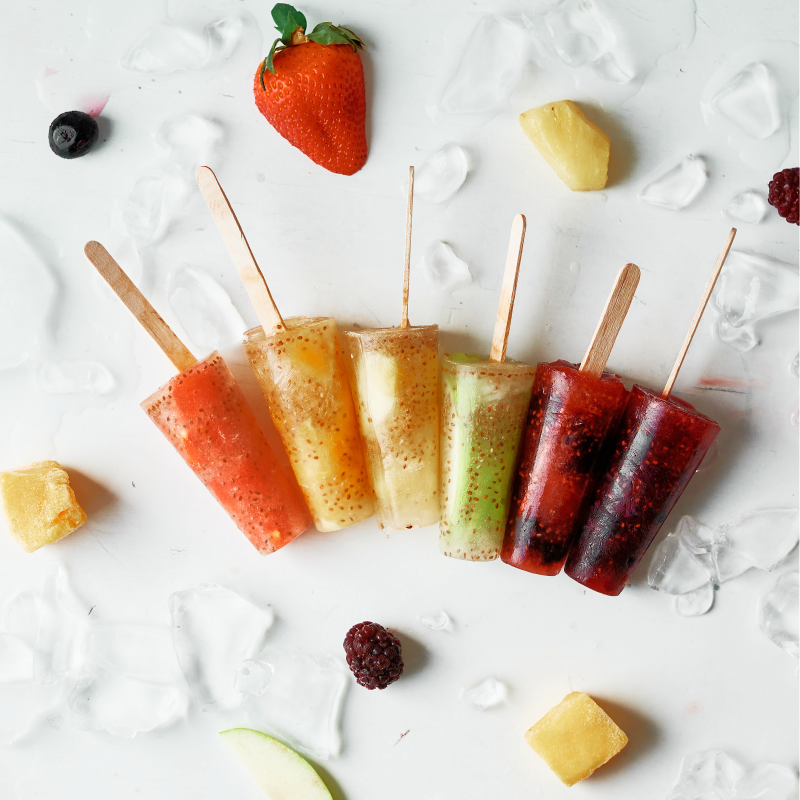 Make popsicles at home that you can feel good about serving your kids with this delicious healthy rainbow ice pops recipe! Made with juice, chia seeds and fresh fruits the flavor and color combinations are endless with this easy treat! #icepops #chiaseeds #healthysnack #recipe #fruit #rainbow #rainbowfood #homemade