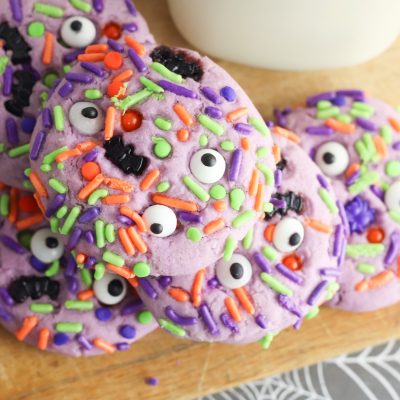 They're creepy and they're kookie, they're all together spooky! Grab this easy Monster Mash Halloween Sugar Cookie Recipe for baking with kids! Perfect for family Halloween fun and classroom Halloween party snack ideas! #Recipe #cookies #Halloween #Monster #PurpleFood #FamilyFriendly #CookingWithKids #Homemade