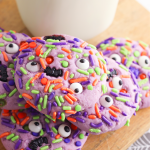 They're creepy and they're kookie, they're all together spooky! Grab this easy Monster Mash Halloween Sugar Cookie Recipe for baking with kids! Perfect for family Halloween fun and classroom Halloween party snack ideas! #Recipe #cookies #Halloween #Monster #PurpleFood #FamilyFriendly #CookingWithKids #Homemade