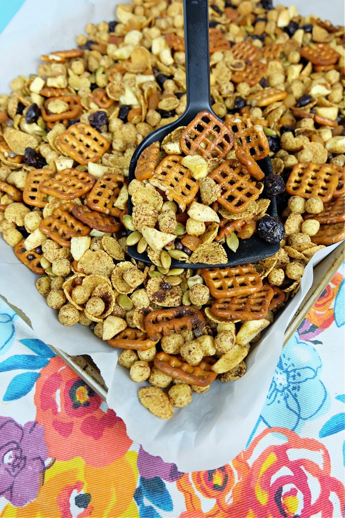 This delicious pumpkin spice fall snack mix recipe is the perfect snack for kids (and adults) looking for a healthy snack. Vegan and nut free, this cereal trail mix recipe is school safe and is a perfect classroom halloween party snack idea! #snack #Recipe #SnackIdea #trailmix #snackmix #cerealmix #cerealrecipe #halloween #fall #autumn #pumpkinspice #homemade #kidfriendly #kidscooking #kidsbaking #snackmix