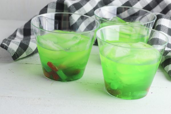 This 5 ingredient, sweet and sour Halloween Mocktail is a family favorite! With sweet and sour gummy worms your kids will ask for this punch, year after year!