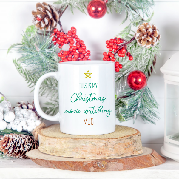 Do you love Christmas movies? Me too! There's nothing better than curling up on the couch with a mug of something warm cupped in your hands, the fire roaring and a good Christmas movie on the TV. Create an adorable "This Is My Christmas Movie Watching Mug" for your hot chocolate, tea or coffee! Make extras as fun and festive handmade gifts for yourself your Christmas movie watching friends and family members using this cut file and your Cricut, Silhouette or other electronic cutting machine! #CricutChristmas #Cricut #Silhouette #Handmade #SVGFile #CutFile #ChristmasSVG #ChristmasCrafts #ChristmasCrafting #ChristmasMovies
