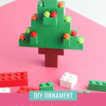In this adorable kids craft project, you'll learn how to make a DIY Lego Christmas Tree Ornament! With step-by-step instructions and photos this is an easy Christmas craft your whole family will have fun with! #ChristmasCraft #ChristmasOrnament #ornament #lego #LegoChristmas #KidsCraft