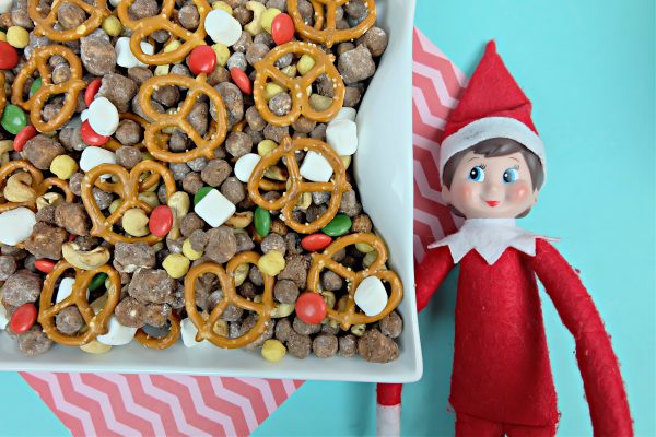 Yummy Chocolate Peanut Butter Cereal Christmas Snack Mix Next To Elf On The Shelf.