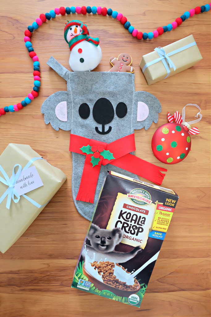 Sew a beautiful DIY Koala Felt Stocking in 30 minutes with this quick and easy sewing tutorial. Includes step by step photos and instructions along with free pattern to cut with scissors or SVG file to cut with your Cricut or Silhouette. Makes a beautiful quick and easy handmade Christmas gift idea for an animal lover! #Koalas #Felt #Stocking #sewing #christmas #DIYStocking #Crafts #ChristmasCrafts #HandmadeGifts