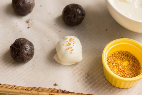 Garnish each truffle with golden sprinkles. Refrigerate for about 20 minutes or until set.