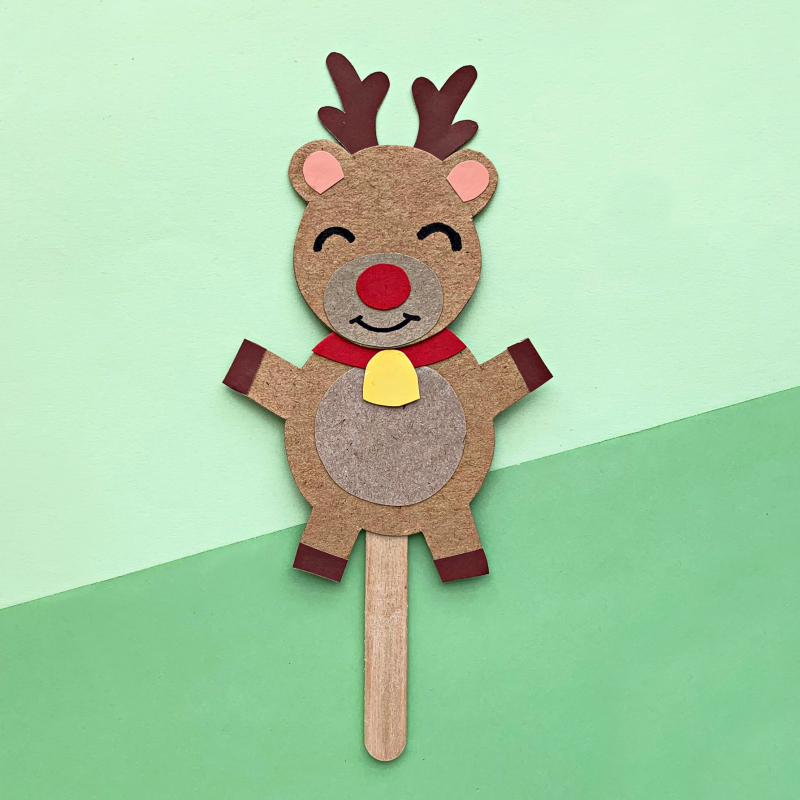 Make a DIY Rudolph Reindeer Puppet in this festive Christmas craft for kids! Includes a free printable template for Christmas crafting fun! Have a family Christmas puppet show! #papercrafts #printables #freeprintables #christmasprintables #kidscrafts #rudolph #reindeer