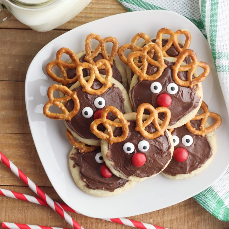 Get in the holiday spirit with some Christmas baking with kids! Use this Chocolate Reindeer Cookie Recipe to make Rudolph cookies to leave for Santa Claus! #Christmas #Santa #Reindeer #ChristmasCookies #Rudolph #ChocolateCookies #Christmasbaking #BakingWithKids #ChristmasBakingWithKids